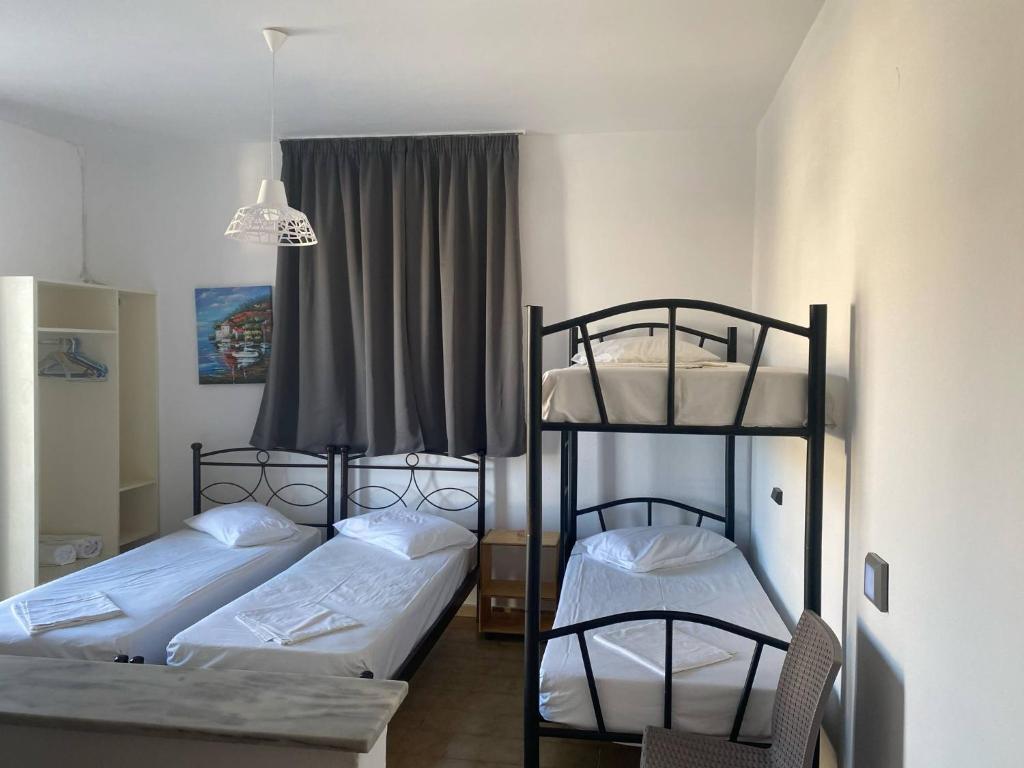 Postel nebo postele na pokoji v ubytování Mary Studios
