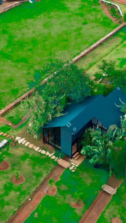an overhead view of a house with a blue roof at Twenty ritz cottage in Migori
