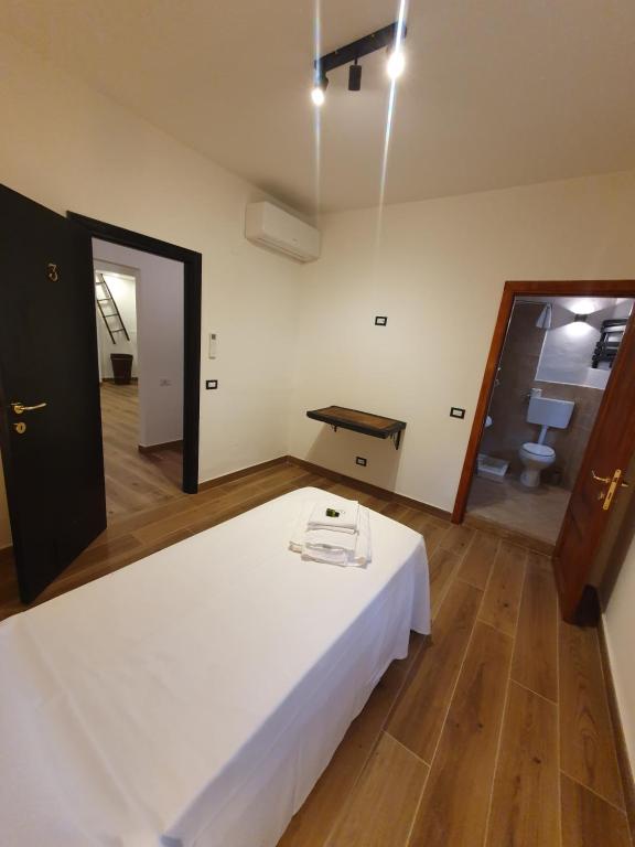 Postel nebo postele na pokoji v ubytování L'Alberghetto Le Dimore Di Contrasti