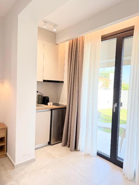Kuchyň nebo kuchyňský kout v ubytování Malka Premium Suites