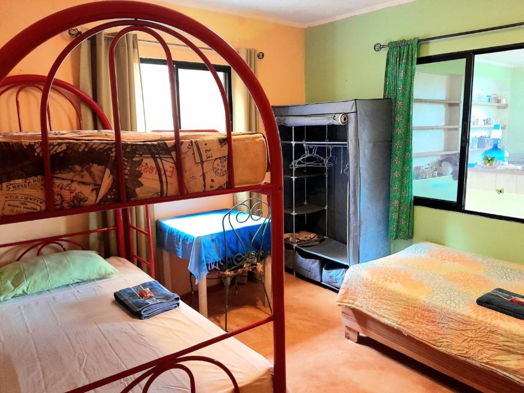 Postel nebo postele na pokoji v ubytování La Hacienda Hostel