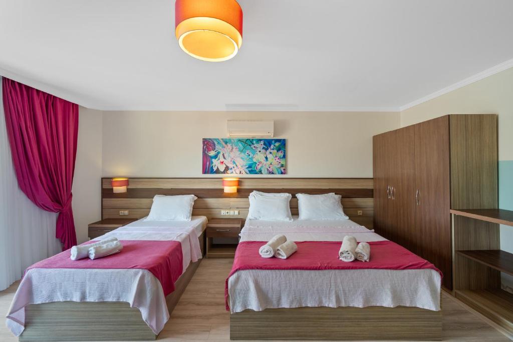 Postel nebo postele na pokoji v ubytování Eden Pyara Hotel Turunc