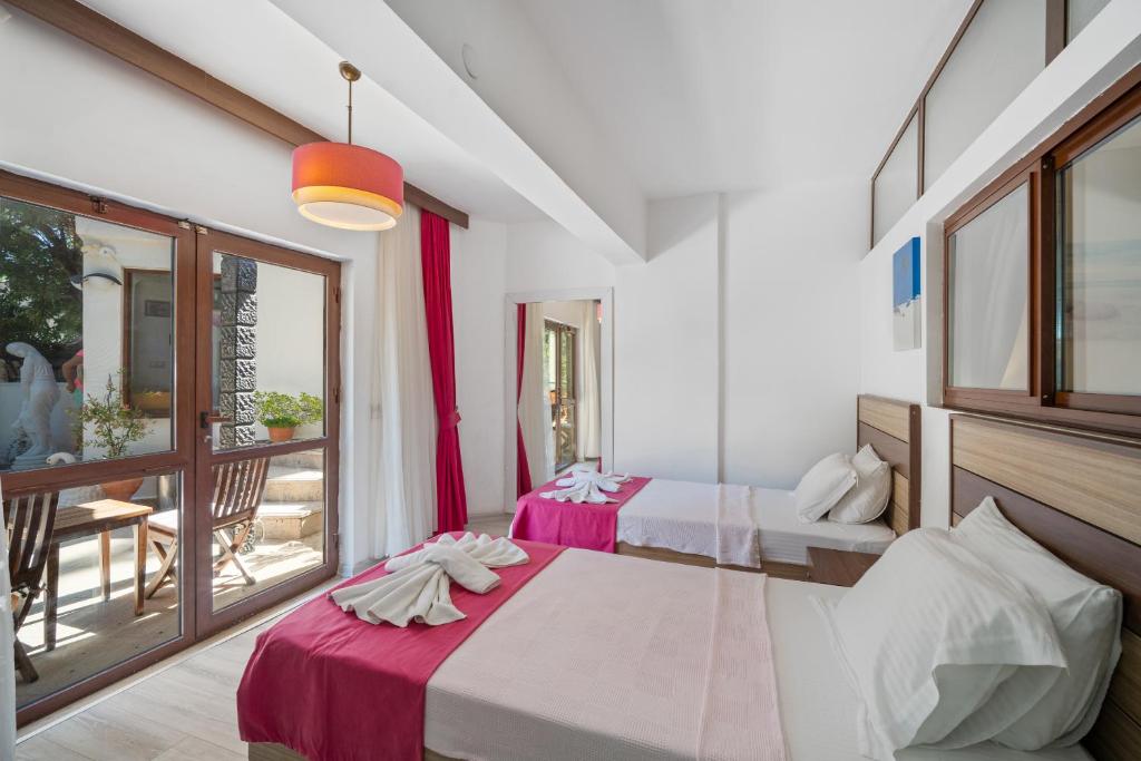 Postel nebo postele na pokoji v ubytování Eden Pyara Hotel Turunc