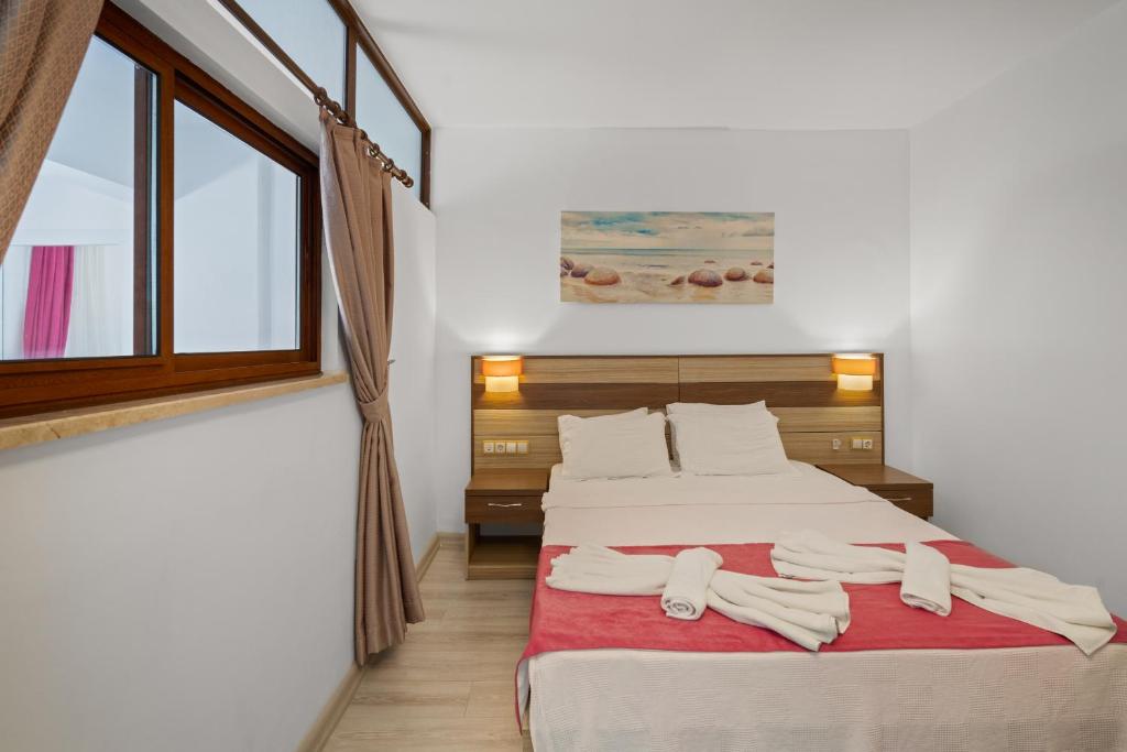 Postel nebo postele na pokoji v ubytování Eden Pyara Hotel Turunc