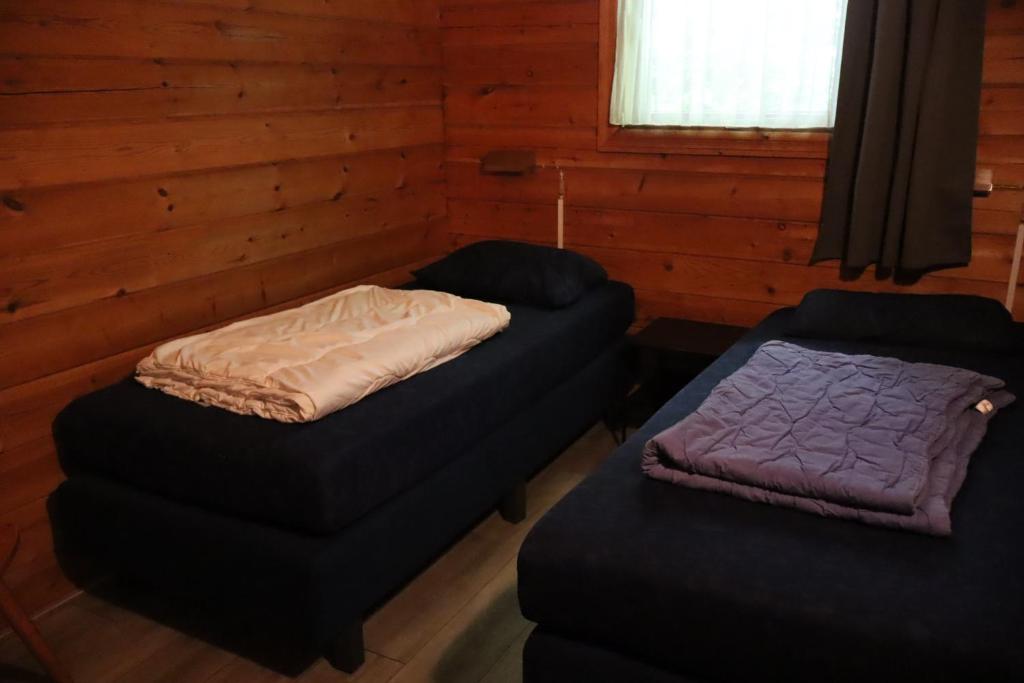 Postel nebo postele na pokoji v ubytování Juromi 42