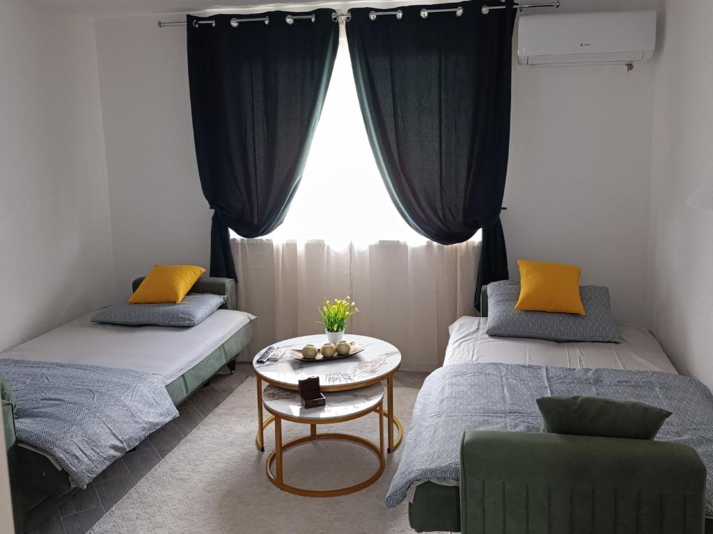 Ένα ή περισσότερα κρεβάτια σε δωμάτιο στο A&A Apartments