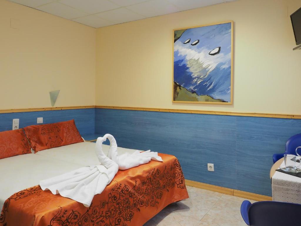 TV a/nebo společenská místnost v ubytování Hostal El Cartero