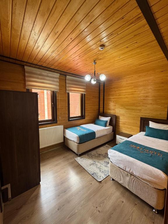 Postel nebo postele na pokoji v ubytování Şimo Suite Otel
