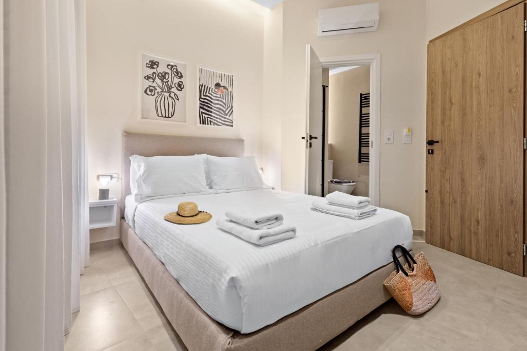 Postel nebo postele na pokoji v ubytování Enea City Suites