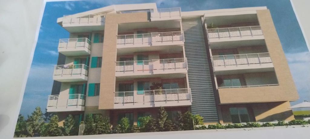 a building with balconies on the side of it at Terrazza mare e monti in Alba Adriatica