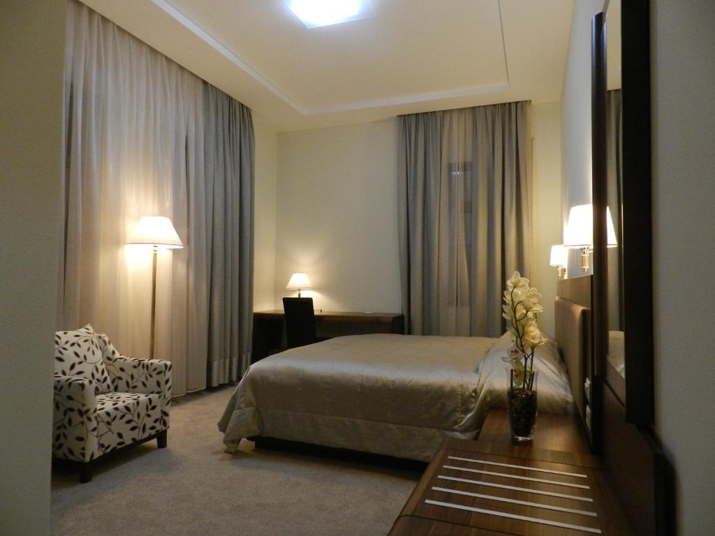 Postel nebo postele na pokoji v ubytování Boutique Hotel Kotoni