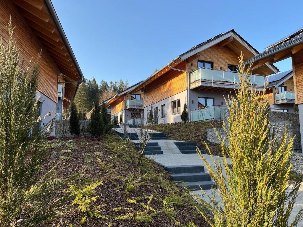 a row of buildings with stairs in a yard at modernes Chalet in Hahnenklee in Hahnenklee-Bockswiese