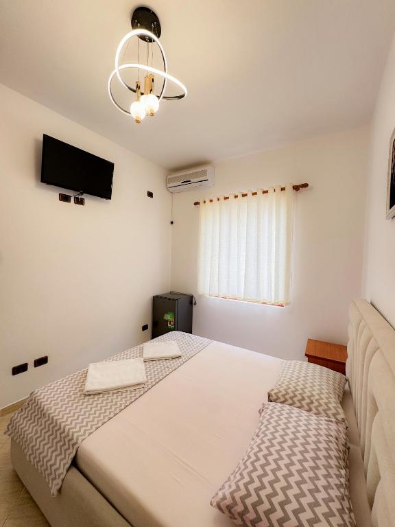 Postel nebo postele na pokoji v ubytování Eden Hotel