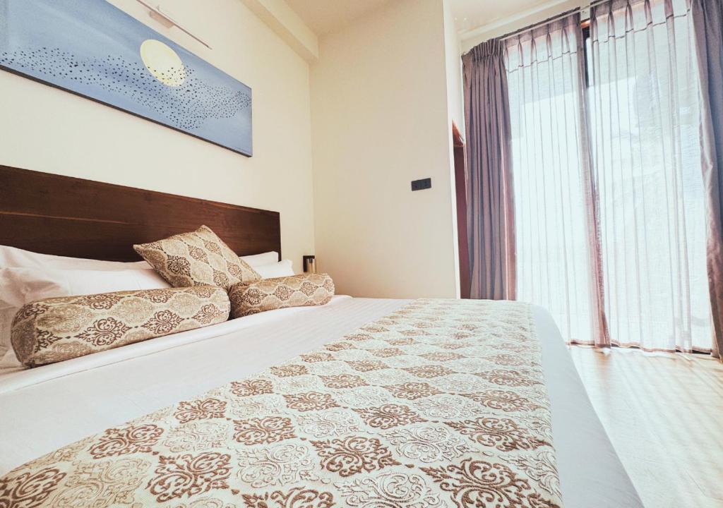 Postel nebo postele na pokoji v ubytování Diyakawa Boutique Hotel