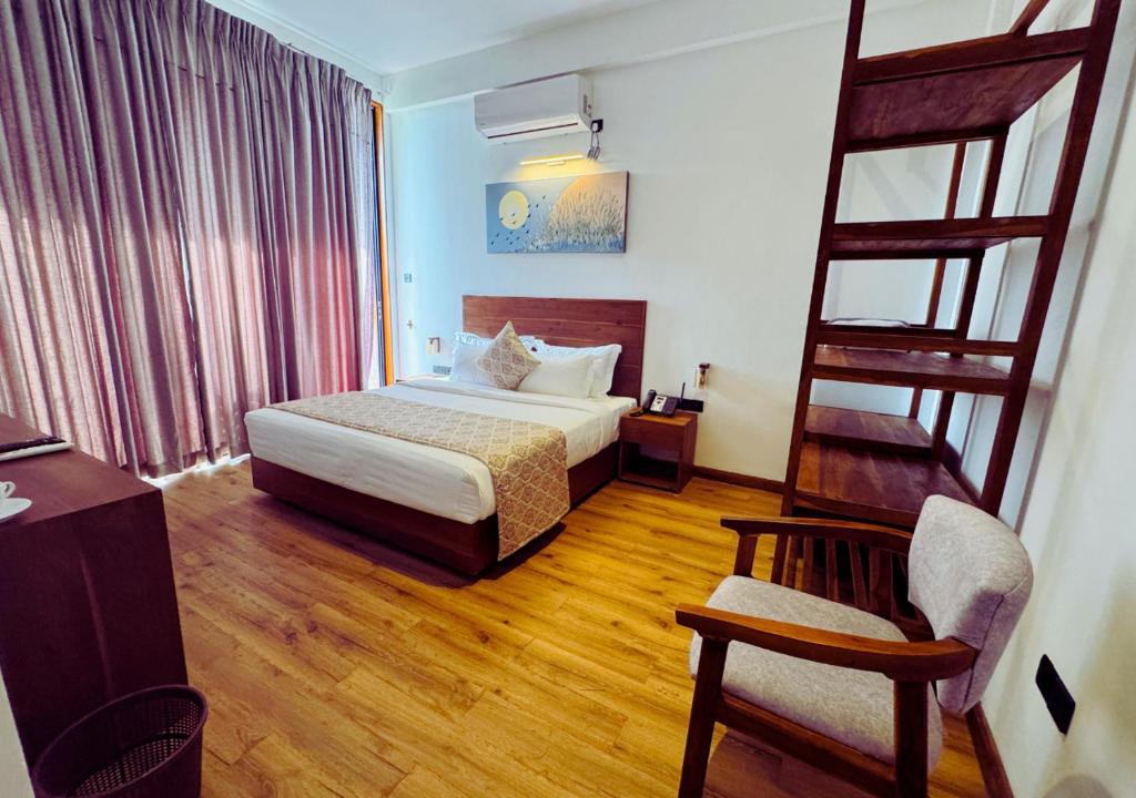 Postel nebo postele na pokoji v ubytování Diyakawa Boutique Hotel