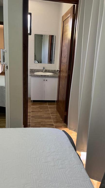 Postel nebo postele na pokoji v ubytování Hotel Vista al Morro