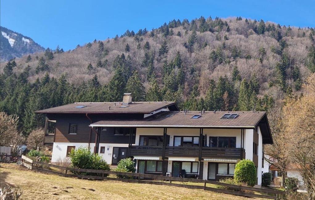 a large house in front of a mountain at Ferienwohnung Gipfelstürmer in Schleching