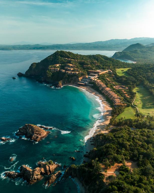 an aerial view of a beach and the ocean at Four Seasons Resort Tamarindo, México in Cihuatlán