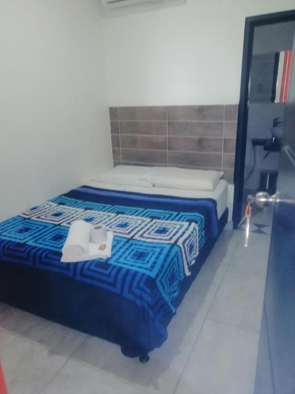 Postel nebo postele na pokoji v ubytování AVENTURa HOTEL