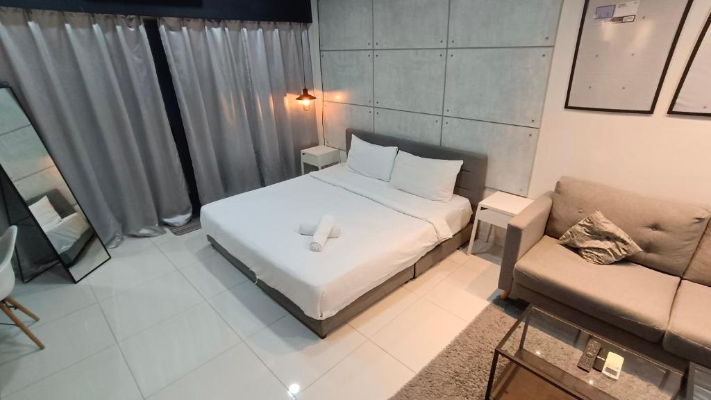 Summer Suites KLCC by CozyNest客房内的一张或多张床位