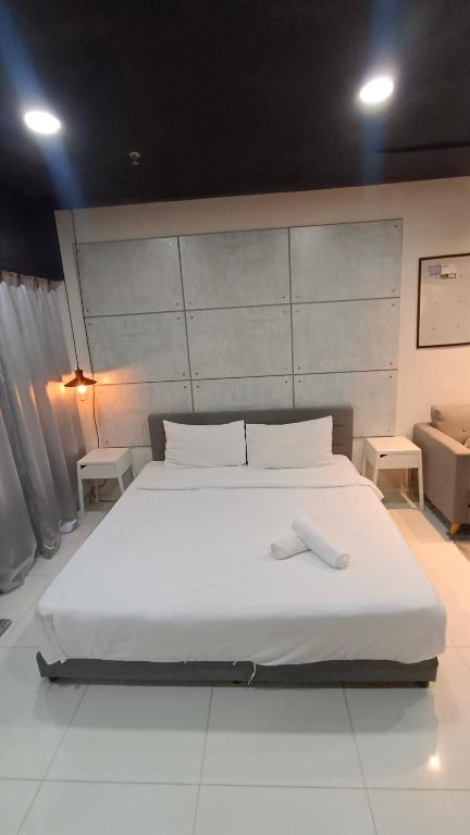 Summer Suites KLCC by CozyNest客房内的一张或多张床位
