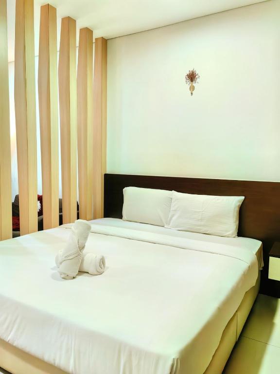 Summer Suites KLCC by CozyNest客房内的一张或多张床位