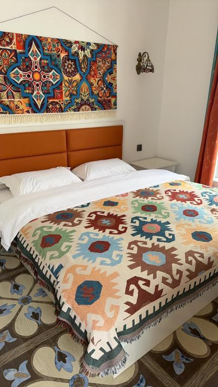 Postel nebo postele na pokoji v ubytování 喀什幸福旅居民宿