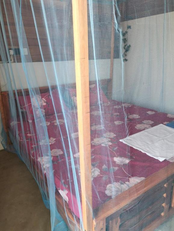 Postel nebo postele na pokoji v ubytování Arugam Bay Beach Morea