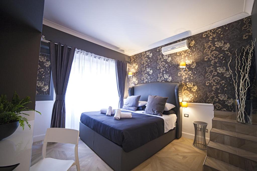A bed or beds in a room at Vatican Luxury Home