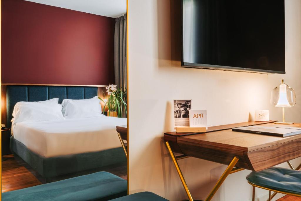 Postel nebo postele na pokoji v ubytování Hotel Ferrara