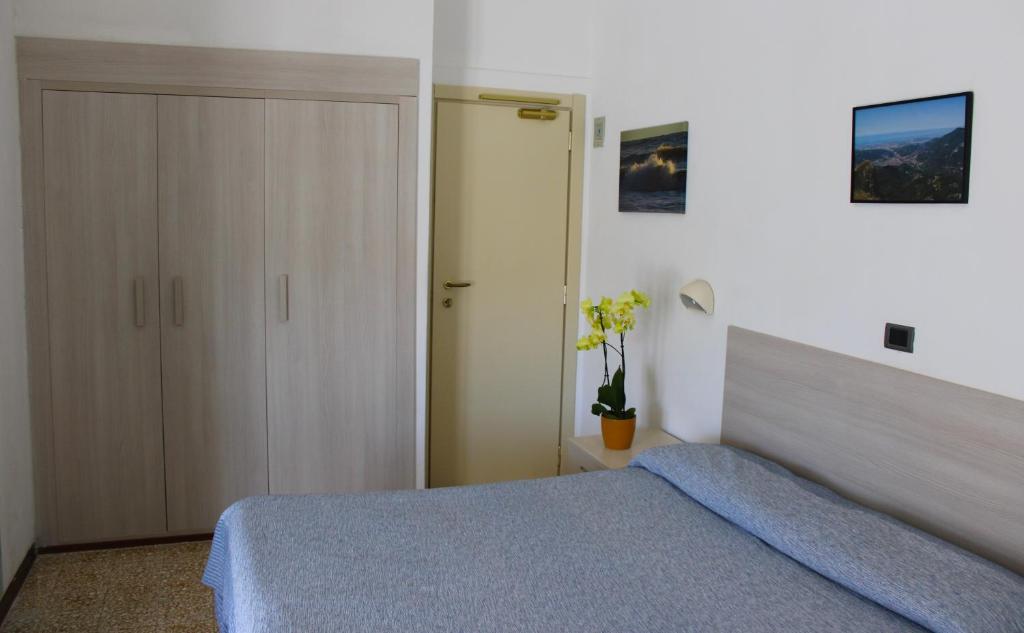 Postel nebo postele na pokoji v ubytování Hotel Puccinelli