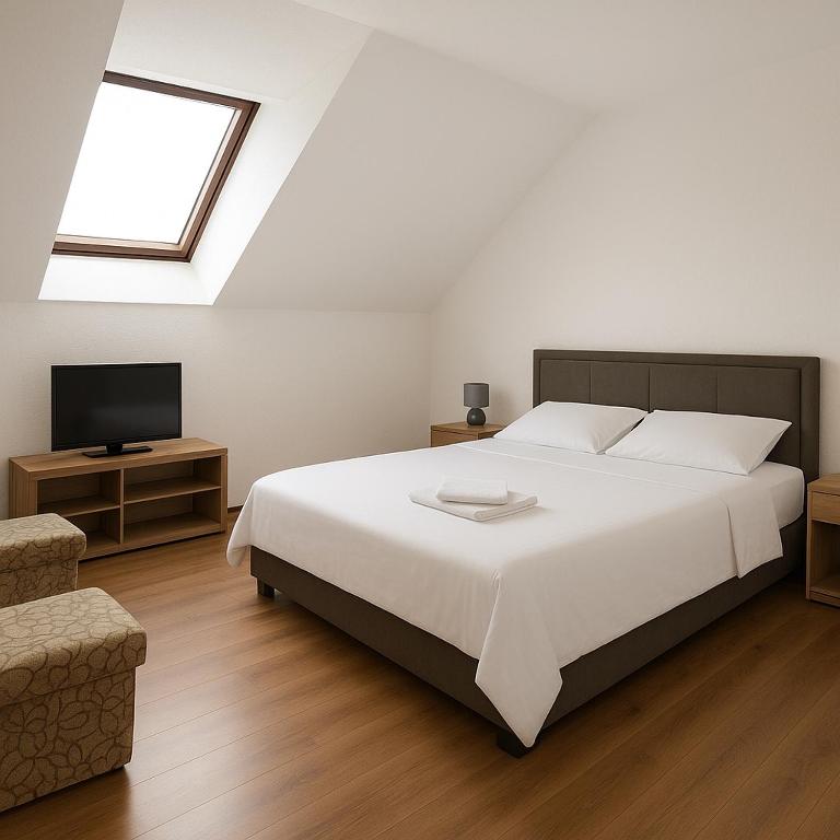 Postel nebo postele na pokoji v ubytování Apartment and rooms D&J