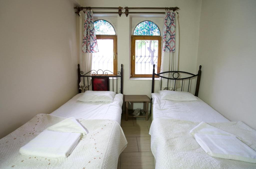 Postel nebo postele na pokoji v ubytování Center cave hostel