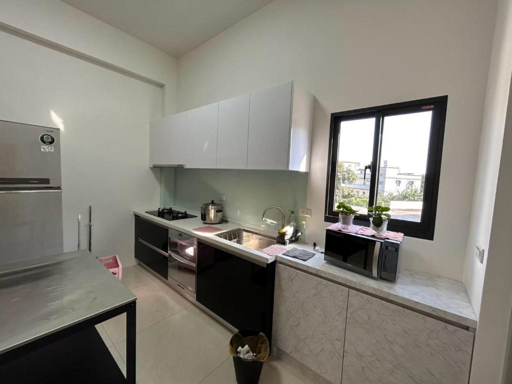 Kuchyň nebo kuchyňský kout v ubytování 十月 Mooon House