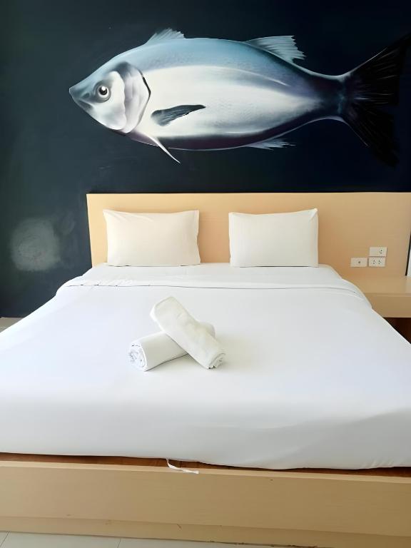 Postel nebo postele na pokoji v ubytování X GO INN Aonang Beach - โกอินน์ อ่าวนาง