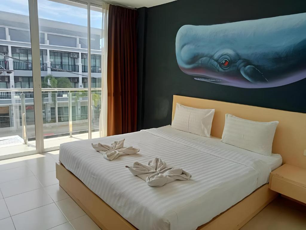 Postel nebo postele na pokoji v ubytování X GO INN Aonang Beach - โกอินน์ อ่าวนาง
