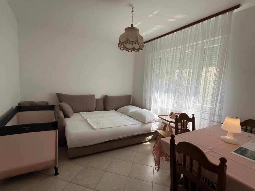 a living room with a couch and a table at Apartment Antonia in Razvala