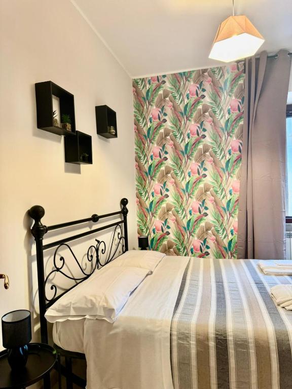 Ένα ή περισσότερα κρεβάτια σε δωμάτιο στο Home at Corso della Repubblica - Cassino centro
