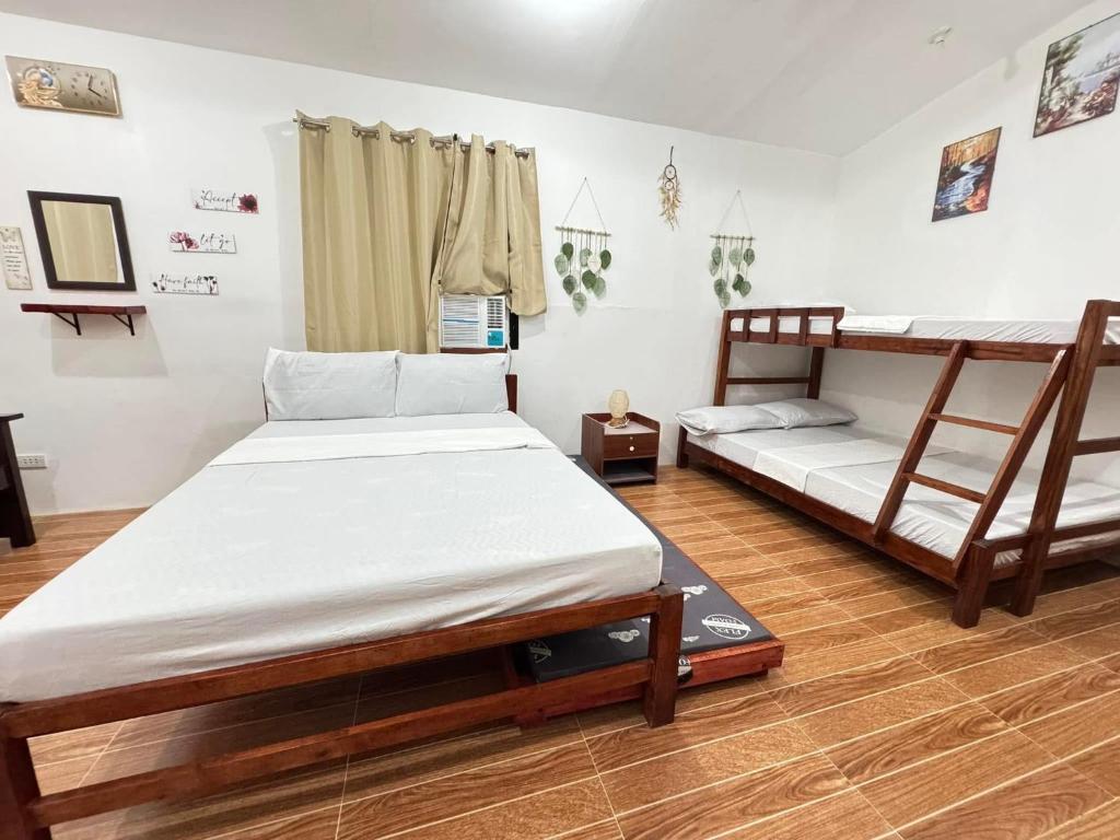 Postel nebo postele na pokoji v ubytování Eulmar Guesthouse In Olango
