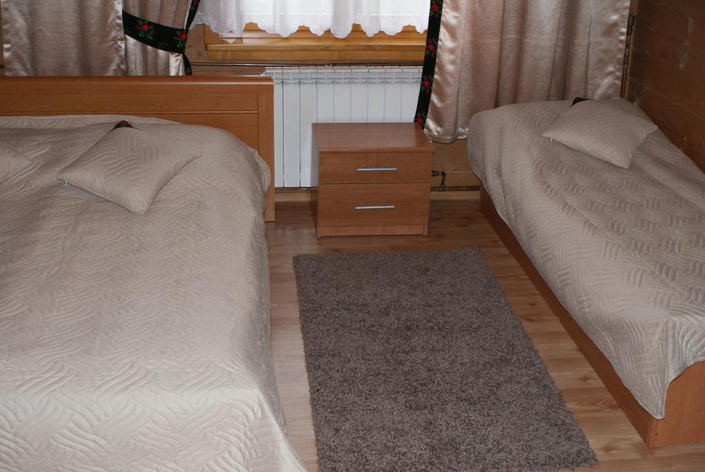 Posteľ alebo postele v izbe v ubytovaní Pokoje u Gronicki