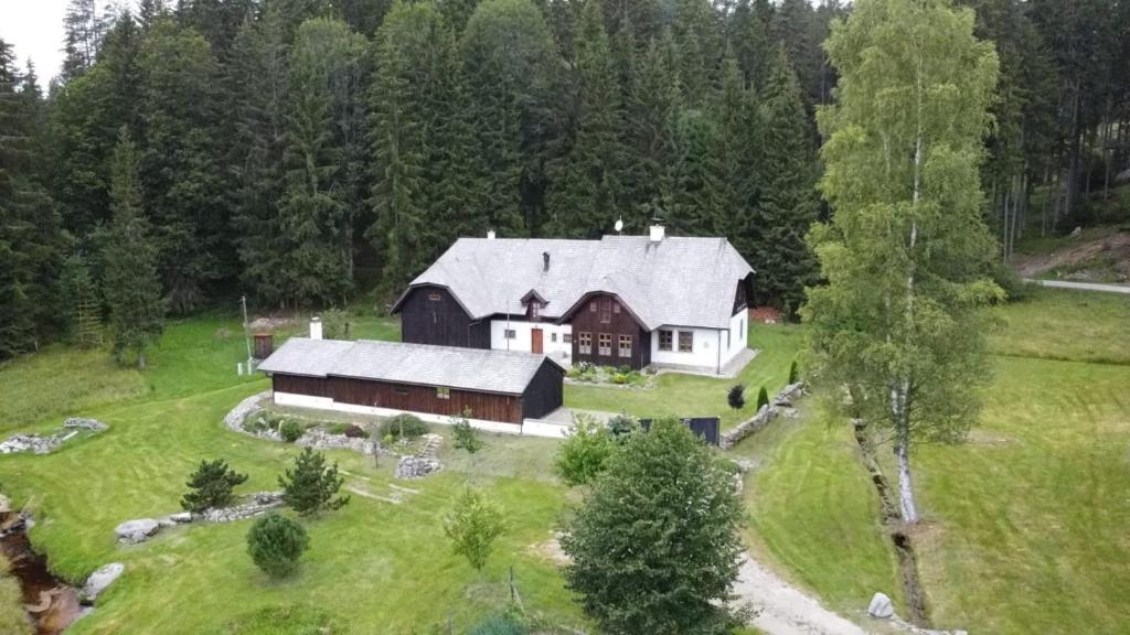 an aerial view of a large barn in a field at Hájovna u Jindřicha in Nová Pec