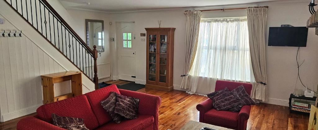 TV a/nebo společenská místnost v ubytování Eastham Cottage Betaghstown