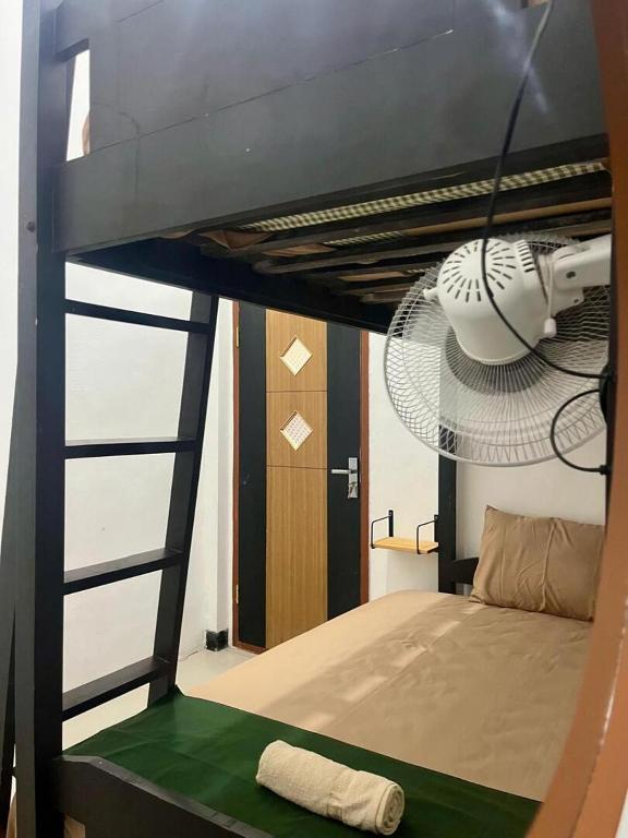 Postel nebo postele na pokoji v ubytování Zzz Hostel Malang