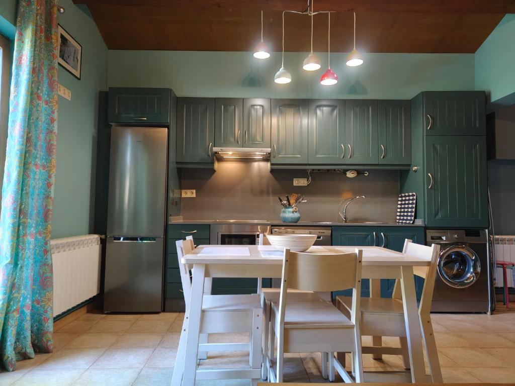 Kuchyň nebo kuchyňský kout v ubytování Apartamentos Rosa Jove
