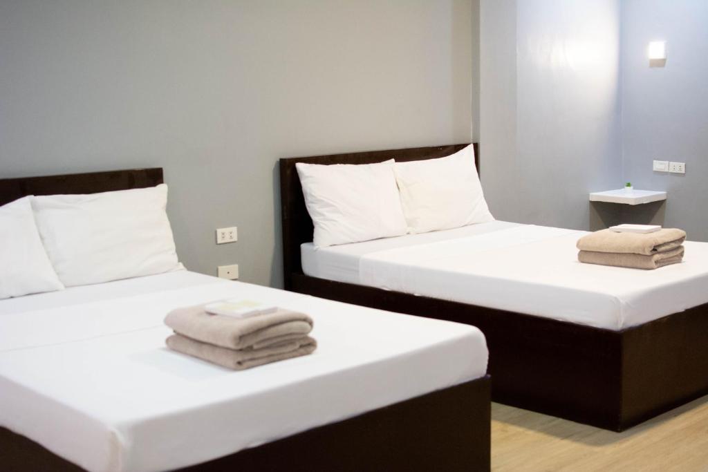 Postel nebo postele na pokoji v ubytování Vincent Resort Hotel