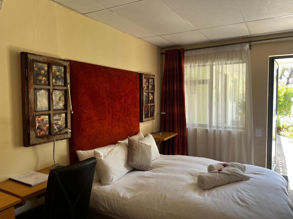 Postel nebo postele na pokoji v ubytování Matthys Guesthouse