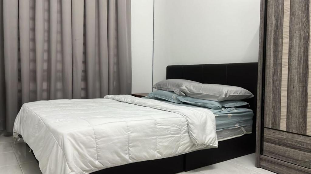 Postel nebo postele na pokoji v ubytování Homestay AZ