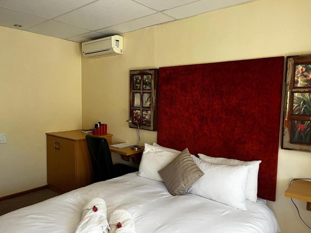 Postel nebo postele na pokoji v ubytování Matthys Guesthouse