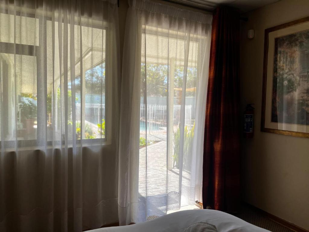 Postel nebo postele na pokoji v ubytování Matthys Guesthouse