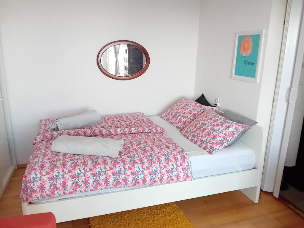 a bedroom with a bed with a mirror on the wall at Holiday Home Nature Plesivica in Jastrebarsko